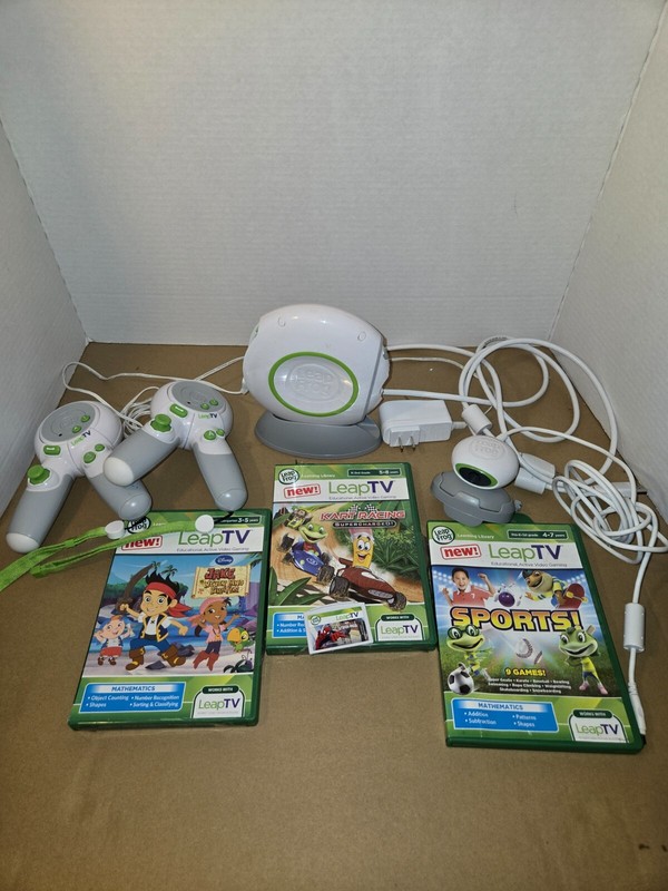 LeapFrog LeapTV Educational Video Gaming System + Games. Read description.