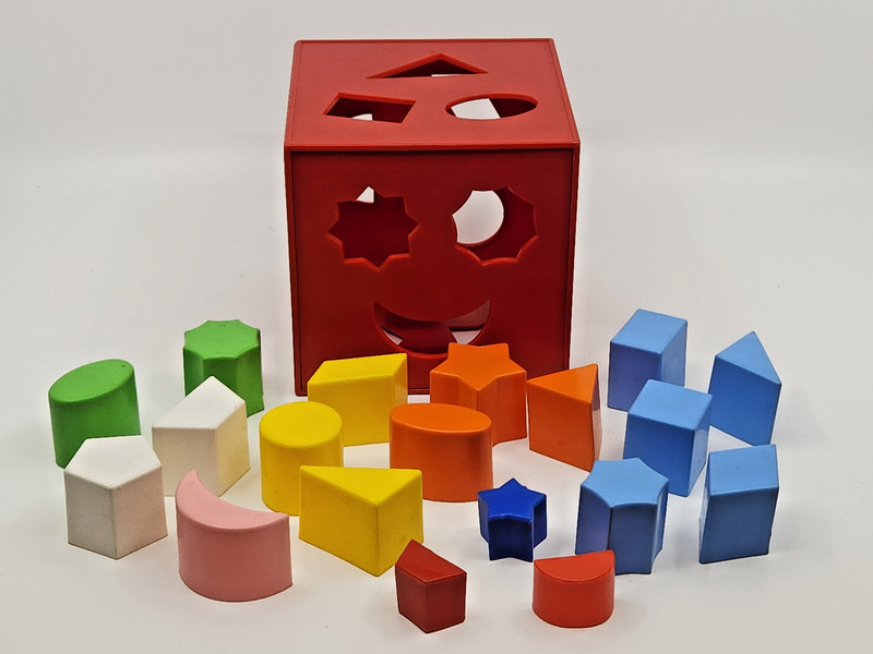Child Guidance Children’s Learning Toy – Red Cube Shapes Sorter w/ 19 Shapes