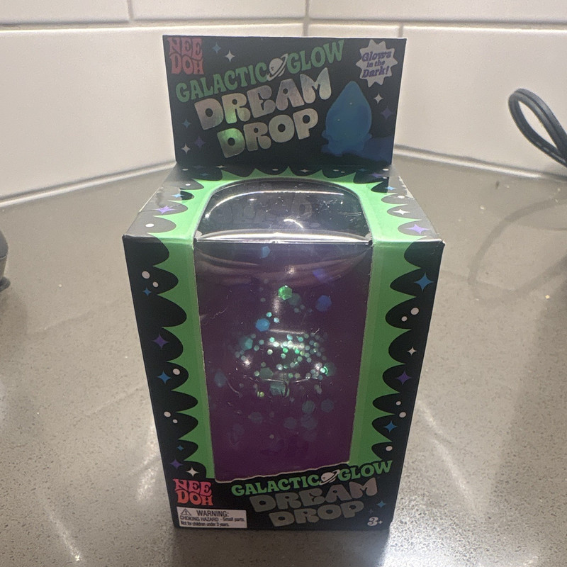 Nee Doh Galactic Glow Dream Drop Squeeze Toy, Glow-in-the-Dark Purple
